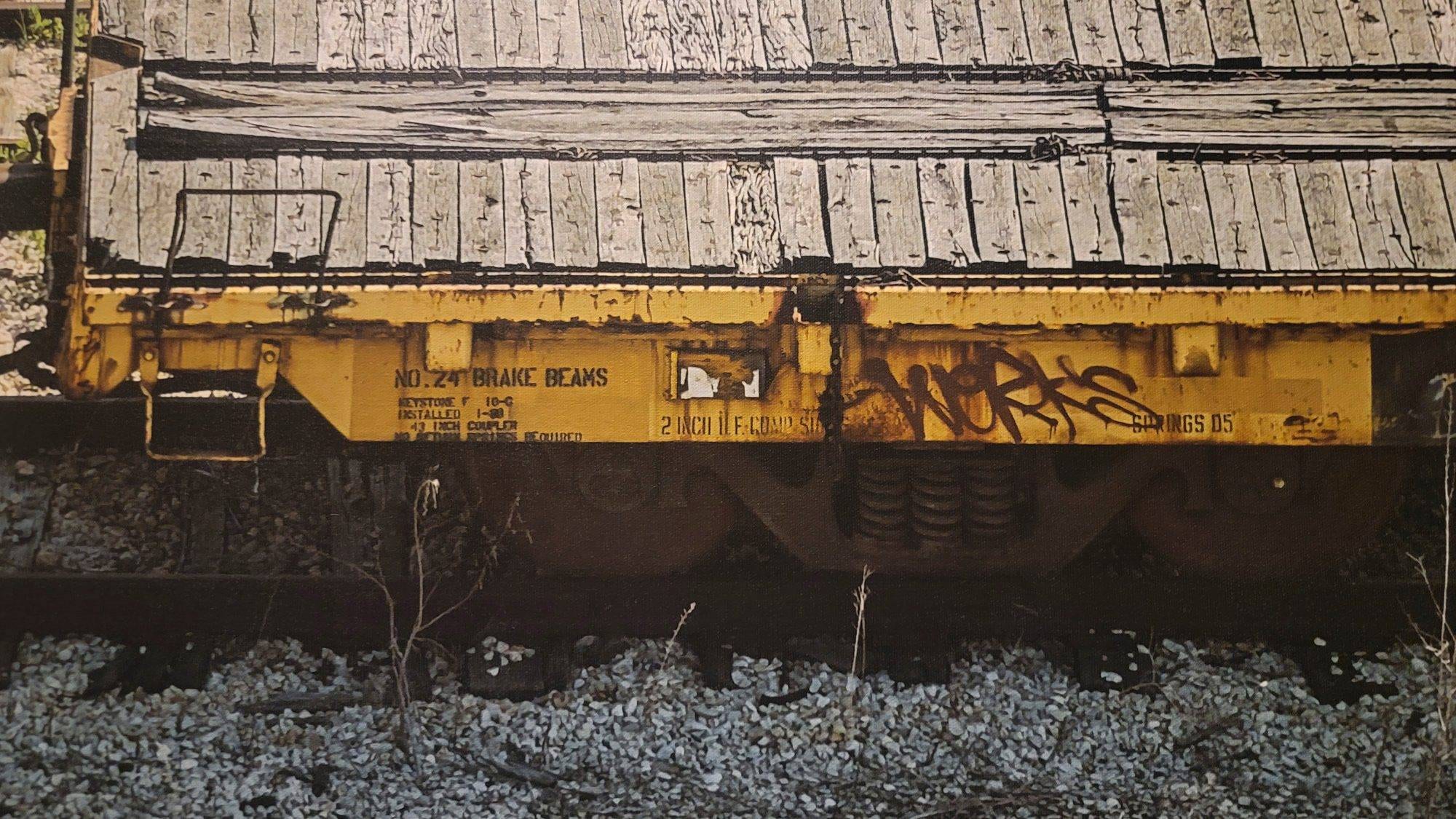 Hyperrealistic detail of a weathered yellow railcar showing industrial text for 'NO. 24 BRAKE BEAMS' and rusted textures.