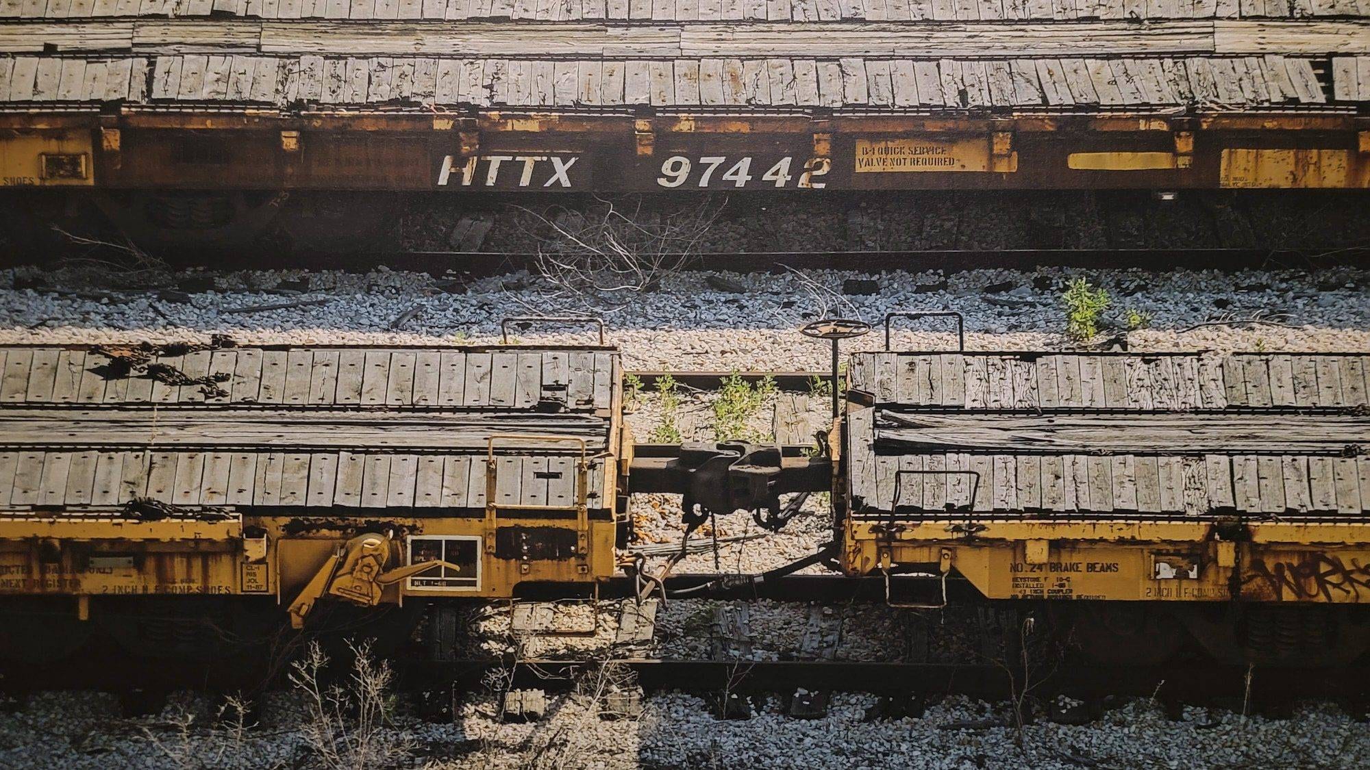 Close-up view of the central composition of HTTX 97442, detailing the number '97442' and the coupling between two railcars.