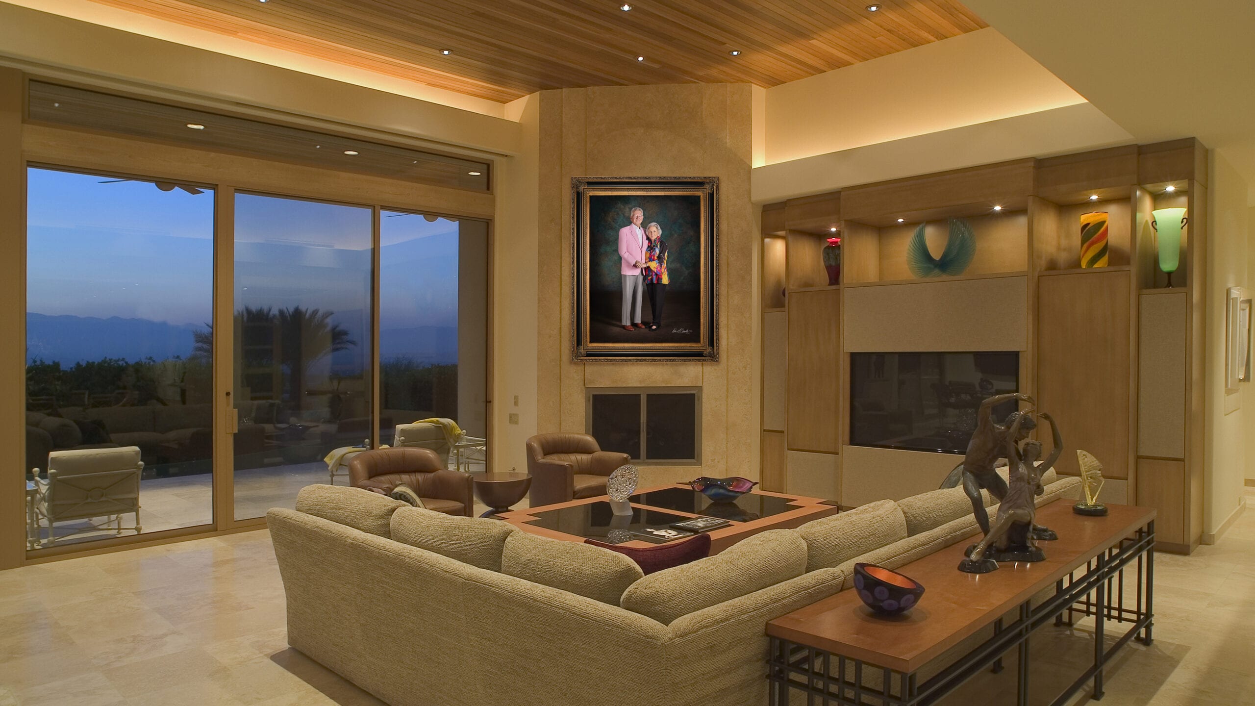 KGS Studios Legacy Portrait of a notable senior couple from South Texas, hung as a centerpiece in a spacious industrial loft with a brick wall.