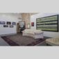 Physical documentation of Kevin G. Saunders | KGS Studios fine art prints in a public exhibition setting. Verifies the public vetting of manual hyperrealism portraits, orchid studies, and HTTX-97442. San Antonio archive proof of physical reality.