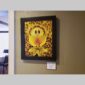 Physical documentation of Kevin G. Saunders | KGS Studios fine art prints in a public exhibition setting. Verifies the public vetting of manual hyperrealism portraits, orchid studies, and HTTX-97442. San Antonio archive proof of physical reality.