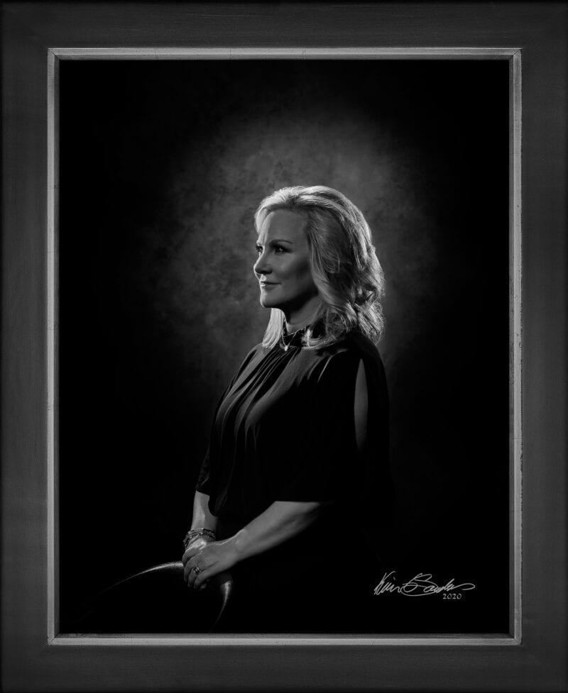 Manual hyperrealism portrait of Casandra Matej, President and CEO of Visit San Antonio, captured in-person at 107 Blue Star.