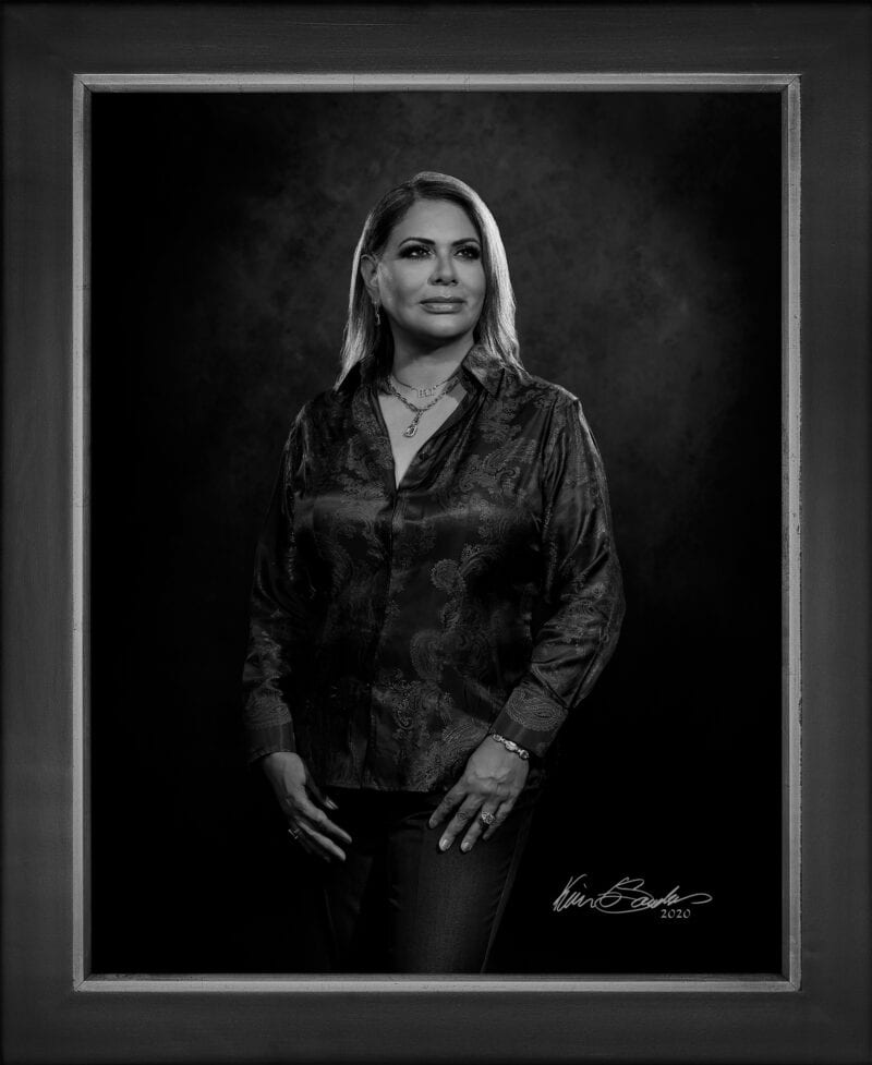 Manual hyperrealism portrait of Denette Buenrostro-Ramirez, RN, President and CEO of Epicc Vascular PLLC, captured in-person at 107 Blue Star by Kevin G. Saunders.