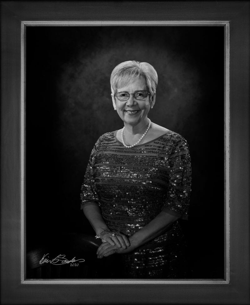 Manual hyperrealism portrait of Janie Barrera, President and CEO of LiftFund, captured in-person at 107 Blue Star by Kevin G. Saunders.