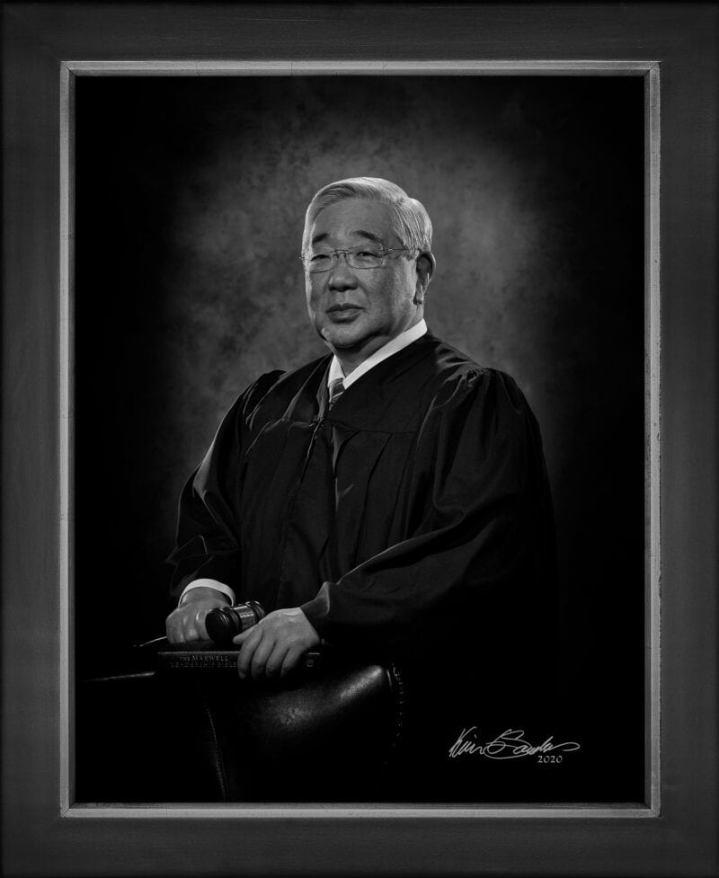 Manual hyperrealism portrait of Judge Peter Sakai, 225th District Court, captured in-person at 107 Blue Star by Kevin G. Saunders.