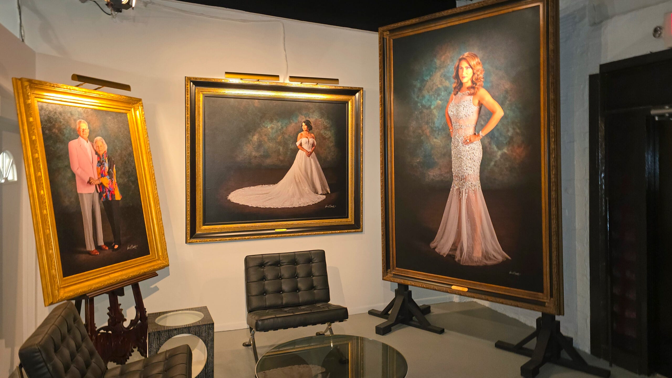 Grand-scale hyperrealistic portraits on display in KGS Studios lobby showing commanding physical presence and permanence