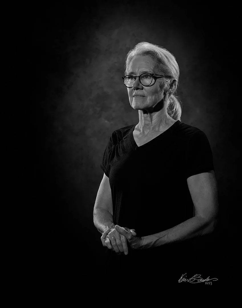 About KGS Studios A professional black and white portrait of Toni C. Saunders, Director Emeritus of KGS Studios, by Kevin G Saunders Master Portrait Artist.