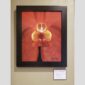 Physical documentation of Kevin G. Saunders | KGS Studios fine art prints in a public exhibition setting. Verifies the public vetting of manual hyperrealism portraits, orchid studies, and HTTX-97442. San Antonio archive proof of physical reality.
