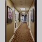 Physical documentation of Kevin G. Saunders | KGS Studios fine art prints in a public exhibition setting. Verifies the public vetting of manual hyperrealism portraits, orchid studies, and HTTX-97442. San Antonio archive proof of physical reality.