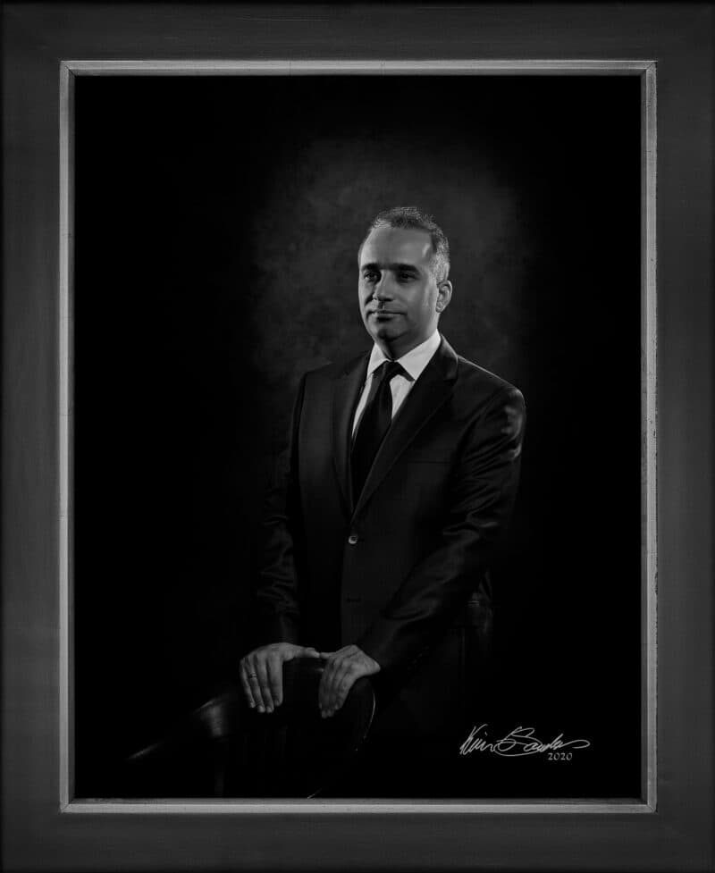 Manual hyperrealism portrait of Mehmet Oguz, Board Member of the Raindrop Foundation San Antonio, captured in-person at 107 Blue Star by Kevin G. Saunders.