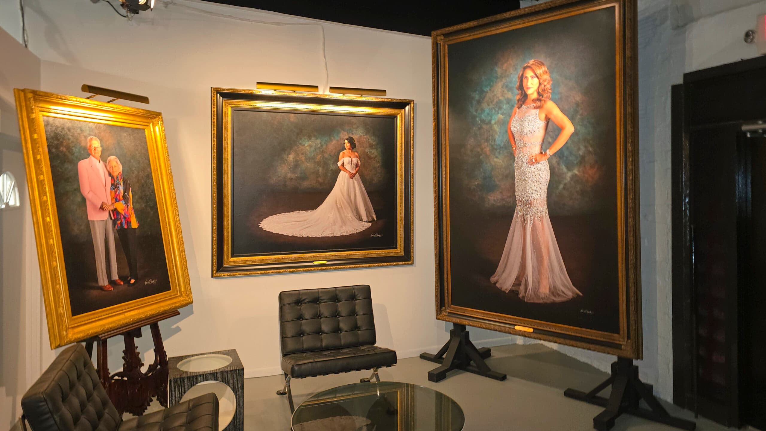 Grand-scale hyperrealistic portraits on display in KGS Studios lobby showing commanding physical presence and permanence