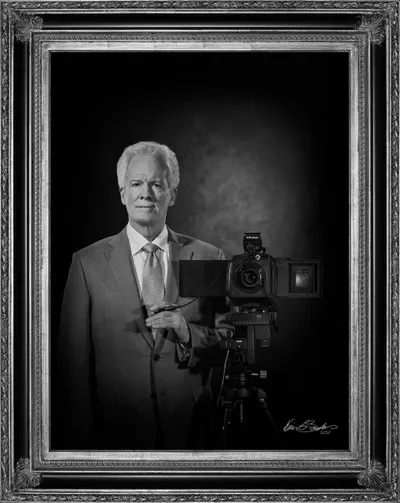 A professional black and white self-portrait of Kevin G. Saunders, Master Portrait Artist.