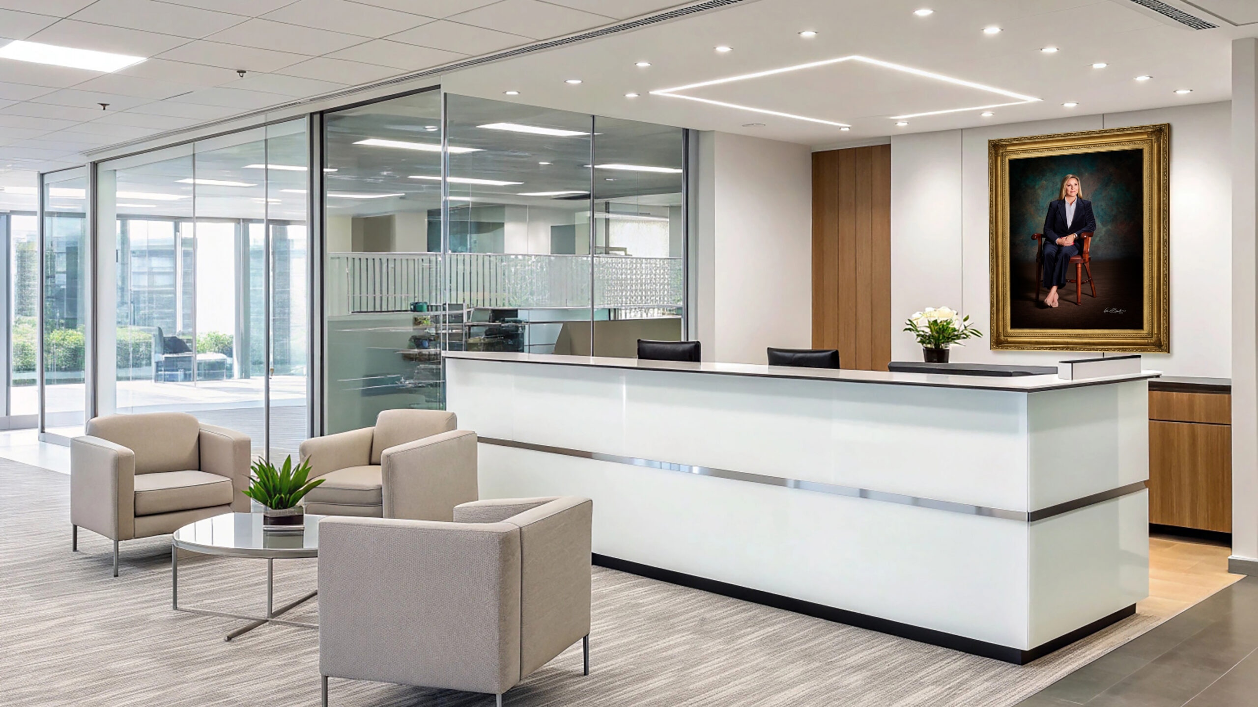 KGS Studios corporate portrait of a female executive, displayed as fine art behind the reception desk in a modern corporate lobby.