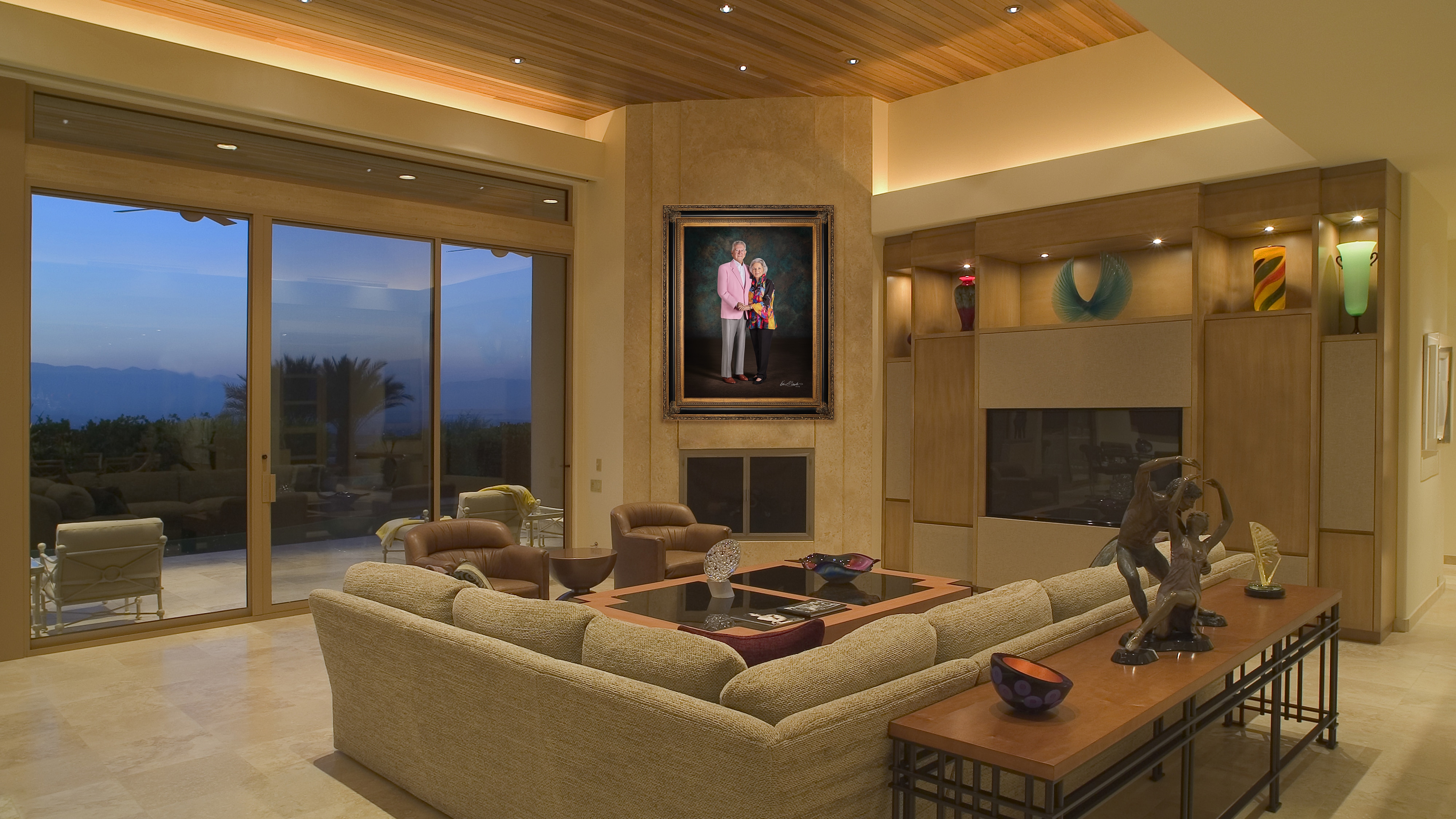 KGS Studios Legacy Portrait of a notable senior couple from South Texas, hung as a centerpiece in a spacious industrial loft with a brick wall.