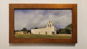 A framed, museum-quality print of Mission San Juan Capistrano by Kevin G. Saunders, part of the World Heritage Collection.