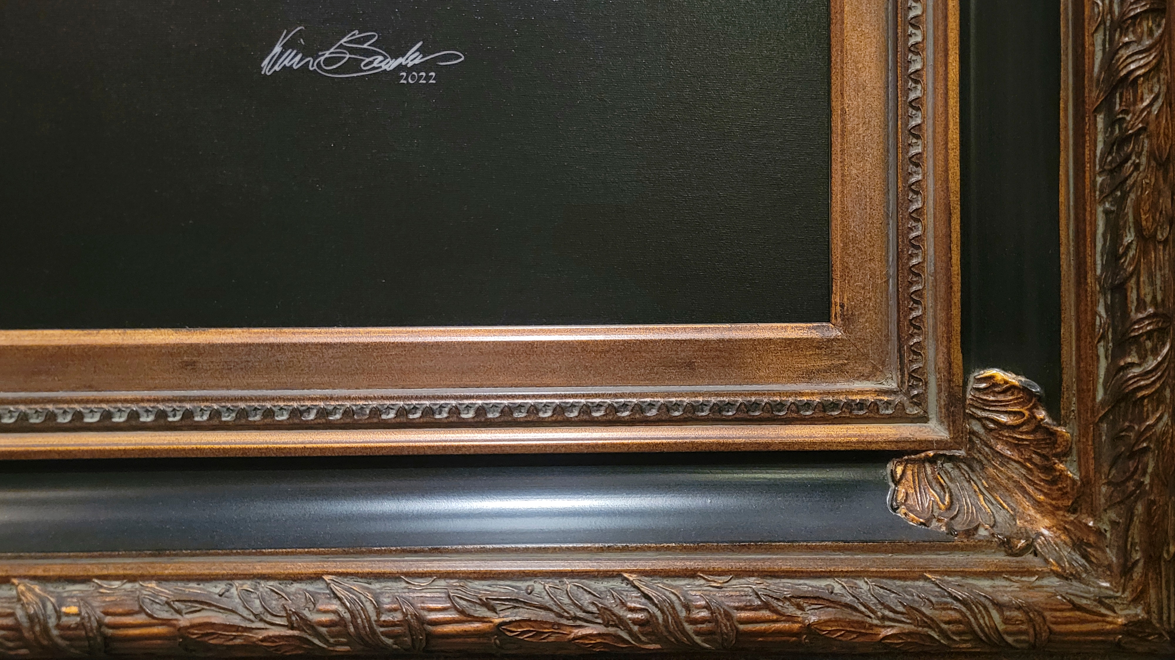 A close-up detail shot of a closed-corner, museum-grade frame on a KGS Studios portrait, showing the intricate craftsmanship.