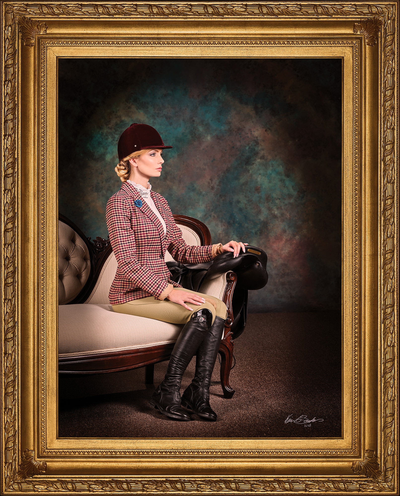 A classical, painterly equestrian portrait of Gigi Boothe in full riding attire, seated on a chaise lounge. A fine art portrait by Master Artist Kevin G. Saunders of San Antonio.