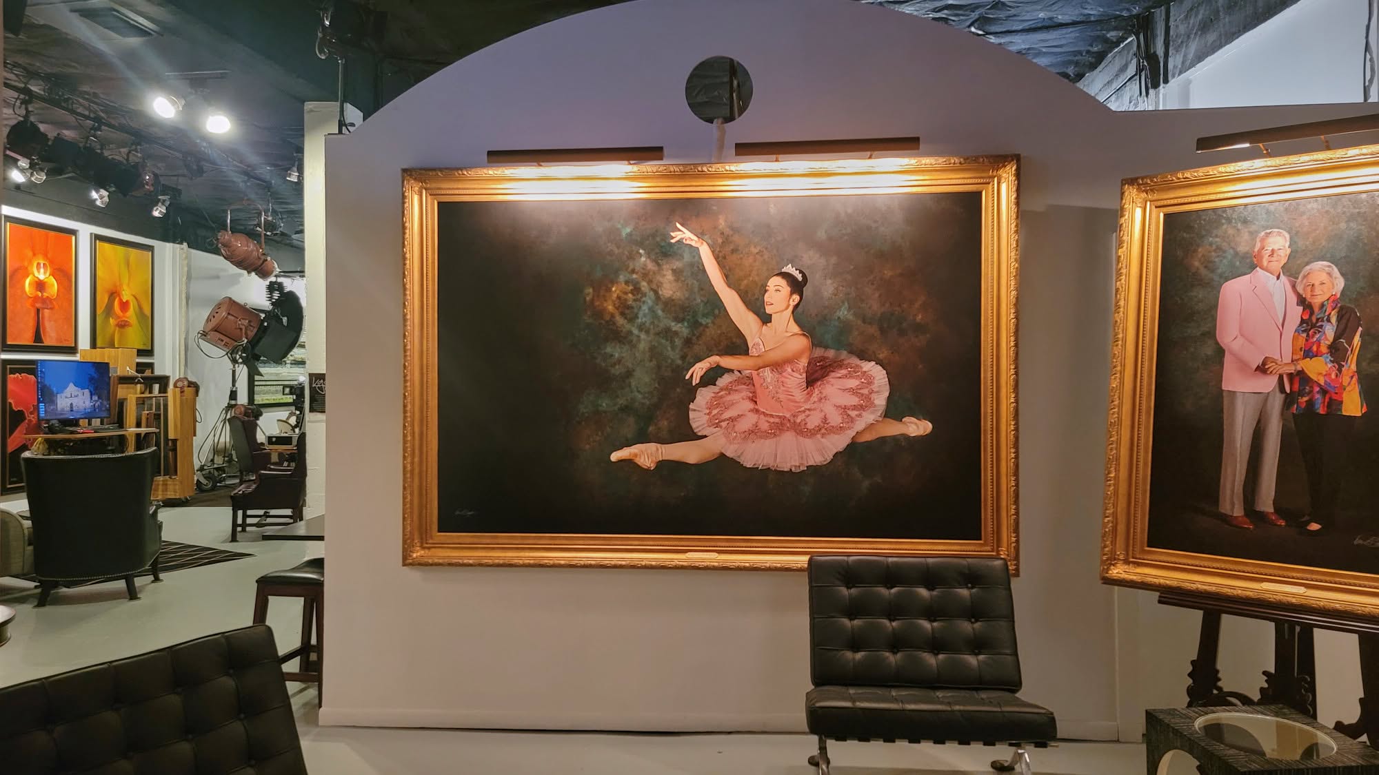 The entrance gallery of KGS Studios, featuring the grand-scale "Felicia McBride" ballerina portrait and other masterpiece commissions in a sophisticated viewing area.