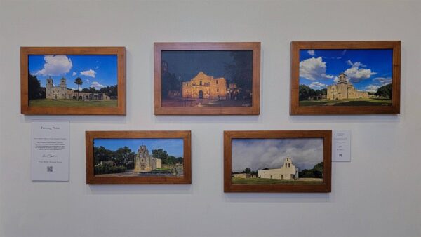 The complete set of five framed Mission prints by Kevin G. Saunders, displayed on a gallery wall.